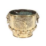 A Dutch Brass Planter, late 19th century, with lion mask loop handles and embossed with a Viking