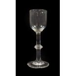 A Wine Glass, circa 1750, the ovoid bowl with basal blade knop on a plain stem with annular knop and