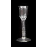 A Cordial Glass, circa 1750, the rounded cylindrical bowl with everted rim on plain stem with