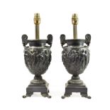 A Pair of Bronze Table Lamps, late 19th century, as twin-handled classical urns cast with a band