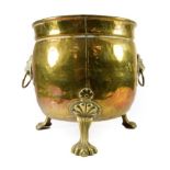 A Brass Planter, in 17th century style, of ovoid form, with lion mask and loop handles, on three paw