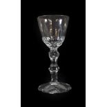 A Wine Glass, circa 1780, the rounded funnel bowl with basal cutting on a faceted double knopped