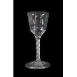 A Wine Glass, circa 1760, the semi-fluted ogee bowl on an air twist stem and folded foot, 16.5cm