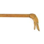 A Walking Stick, late 19th century, the handle carved as the head of greyhound, with bone teeth