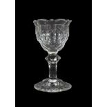 A Sweetmeat Glass, circa 1790, the ogee bowl with geometric cutting on a faceted knopped stem and