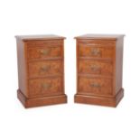 A Pair of Reproduction Burr Oak and Feather-Banded Three Drawer Bedside Chests, the moulded tops