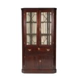 A Mid 18th Century Oak Free-Standing Corner Cupboard, the moulded cornice above astragal glazed