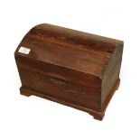 An 18th Century Oak Dome Top Table Box, the hinged lid enclosing a later candle box above two