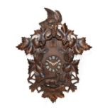A Cuckoo Striking Wall Clock, 20th century, top carved pediment depicting birds, leaf and fruits,