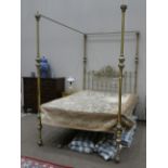 A Victorian Kingsize Brass Four-Poster Bed, circa 1880, the tubular frame with hollow bulbous