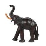 A Leather Covered Model of a Baby Elephant, 20th/21st century, with composition tusks, 99cm high