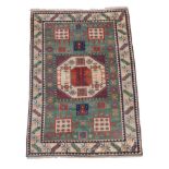 Turkish Carpet of Karachov Kazak Design, modern The mint green field of tribal motifs around an