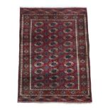 Tekke Rug North West Afghanistan, circa 1960 The claret field of quartered güls enclosed by