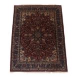 Isfahan Part Silk Carpet Central Iran, circa 1970 The deep brick red field of scrolling vines around