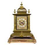A Gilt Metal and Porcelain Mounted Striking Mantel Clock, circa 1880, caddied pediment with urn