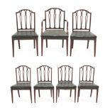 A Set of Seven George III Style Mahogany Dining Chairs, labelled Made by G Baker, Chippendale House,
