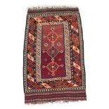 Kashgai Kilim South West Iran, circa 1950 The abrashed aubergine field with three stepped medallions