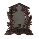 An Austro-German Carved Linden Wood Table Mirror, circa 1900, the foliate frame with dead game above