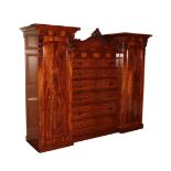 An Early Victorian Mahogany Inverted Breakfront Wardrobe, circa 1860, with six long drawers