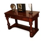 A Victorian Mahogany Dressing Table, circa 1870, the moulded top above two frieze drawers and turned