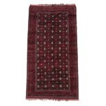 Baluch Rug Afghan/Iranian Frontier, circa 1950 The stepped diamond lattice field of flower heads