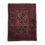 Fine Baluch Rug Iranian/Afghan frontier, circa 1900 The natural camel field with a lattice of