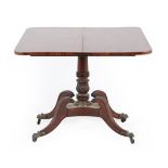 A Regency mahogany foldover tea table, early 19th century, the hinged leaf above a gadrooned frieze,