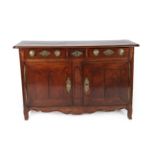 An Early 18th Century French Provincial Oak Sideboard, the three small drawers with brass knob