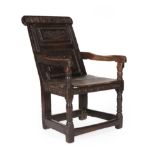 A 17th Century Joined Oak Wainscot Armchair, dated 1675 and initialled LW, the carved top rail above