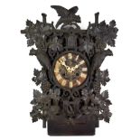 A Black Forest Cuckoo Striking Wall Clock, circa 1890, elaborately carved decorated front mounts