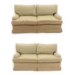 A Pair of Feather-Filled Three-Seater Sofas, modern, with green patten loose covers, with rounded