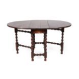 An Early 18th Century Joined Oak Six-Seater Gateleg Dining Table, with oval drop leaves above a