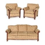 A Carved Mahogany Three Piece Suite, circa 1920/30, recovered in gold floral fabric, comprising a