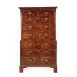 A George II Walnut, Crossbanded and Oak Sided Chest on Chest, 2nd quarter 18th century, the dentil