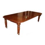 A Victorian Oak Extending Dining Table, circa 1880, with three additional leaves, the moulded edge