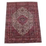 Mashad Carpet North East Iran, circa 1960 The cream field of scrolling leafy vines centred by a