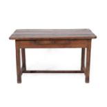 An 18th Century Joined Oak Farmhouse Kitchen Table, the three-plank top above a single drawer, on