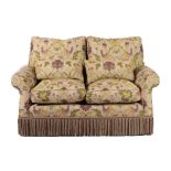 ~ A Two-Seater Feather-Filled Sofa, modern, covered in floral green fabric decorated with exotic