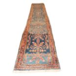 Narrow West Persian Village Runner, circa 1930 The abrashed sky blue field with a single column of