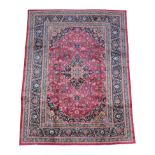 Mashad Carpet North East Iran, circa 1960 the raspberry field centred by an indigo medallion