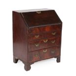 A George II Walnut and Feather-Banded Bureau, 2nd quarter 18th century, of small proportions, the