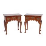 A Pair of Reproduction Burr Elm Lowboys, the quarter-veneered and strung tops above three small