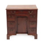 A George III Mahogany Kneehole Dressing Table, late 18th century, the moulded top above a long