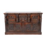 A Victorian Carved Oak Sideboard, 3rd quarter 19th century, of breakfront form with central deep