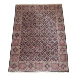 Kirman Carpet South East Iran, circa 1960 The indigo diamond lattice field of plants enclosed by