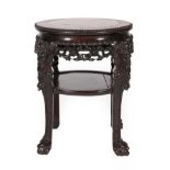 A Chinese Padouk and Pink Marble Plant Stand, circa 1900, of circular form with foliate carved