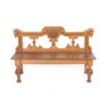 A Victorian Oak Hall Bench, circa 1870, the scrolled back support centred by a crest of rampant