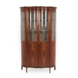 A Mahogany and Satinwood Banded Serpentine Shaped Display Cabinet, circa 1900, the upper section