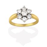 An 18 Carat Gold Diamond Cluster Ring, seven round brilliant cut diamonds, in white claw settings,