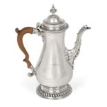A George III Silver Coffee-Pot, Maker's Mark Worn, London, Probably 1764, pear-shaped and on